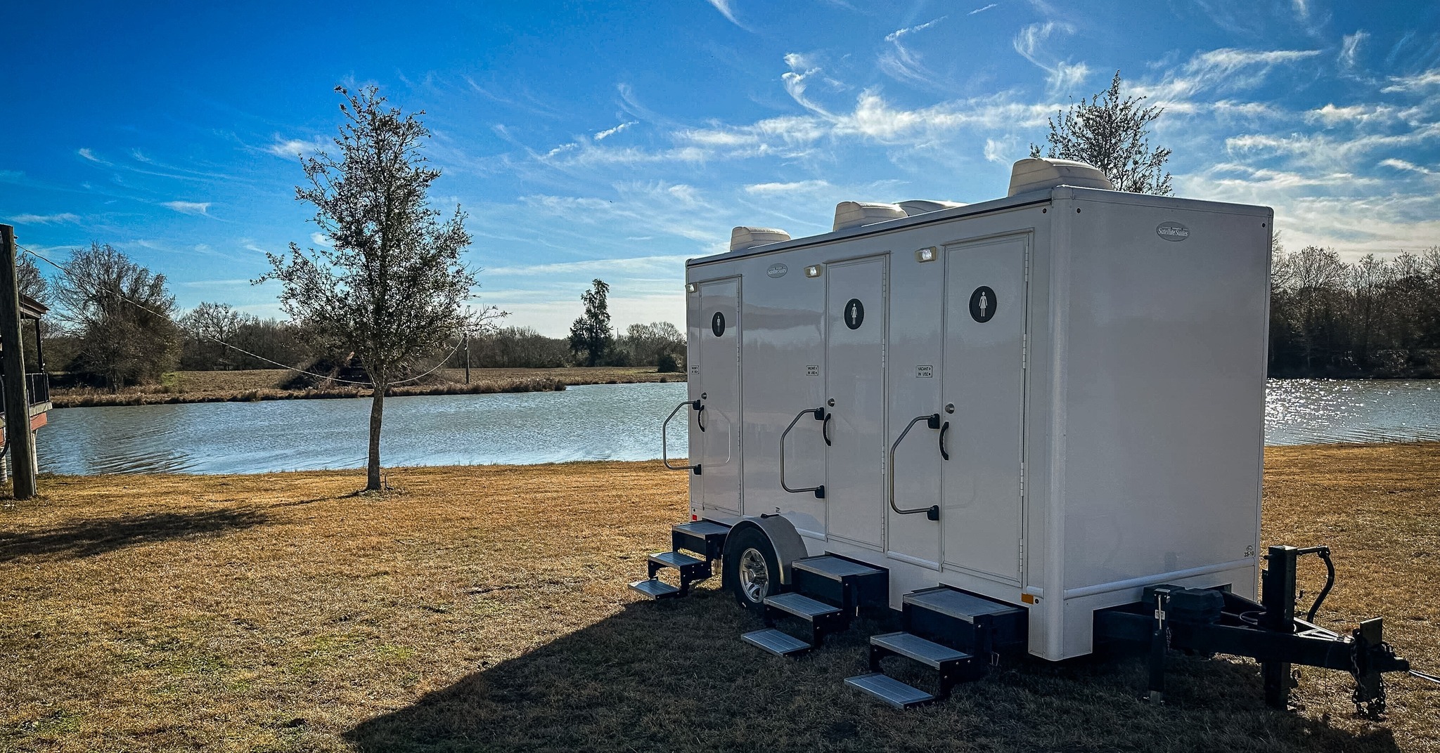 Luxury portable restroom trailer at an event. 