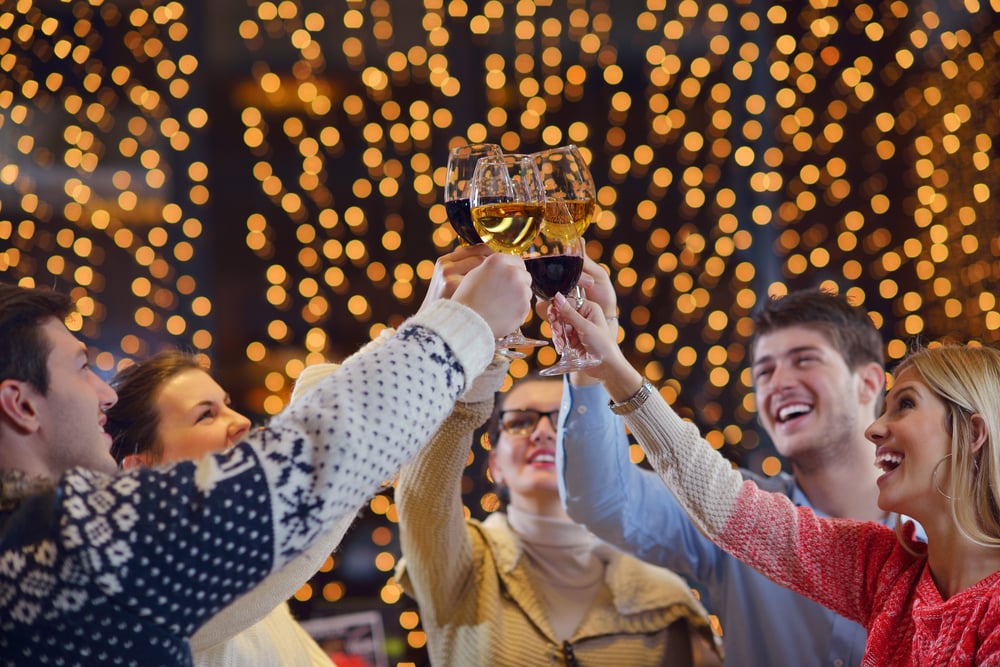 Group of happy young people drink wine at party disco restaurant