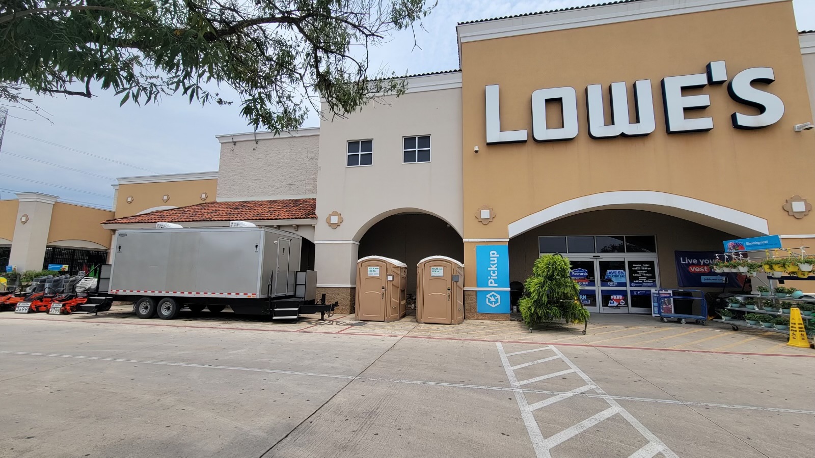 Luxury restroom trailer in front of Lowe's